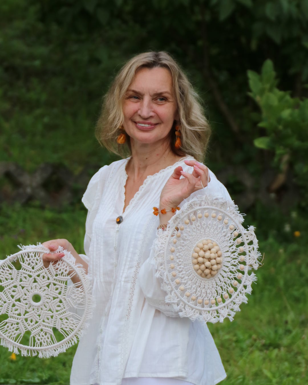 Macrame School teacher with handmade macrame mandalas